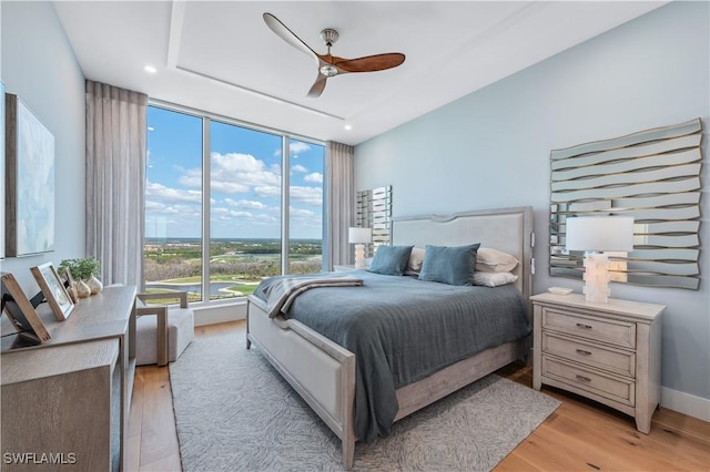 bedroom featuring ceiling fan and light wood-type flooring