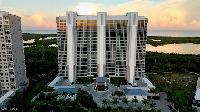 outdoor building at dusk featuring a water view