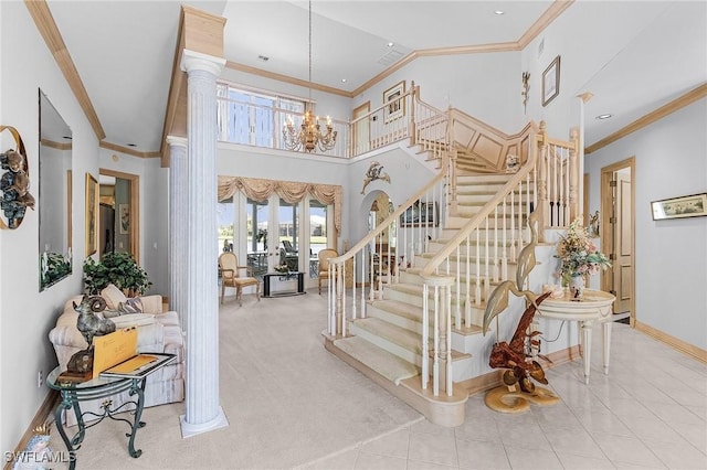 stairs featuring baseboards, tile patterned flooring, a high ceiling, crown molding, and ornate columns