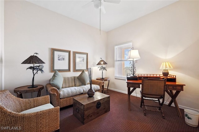 living area featuring ceiling fan and dark colored carpet