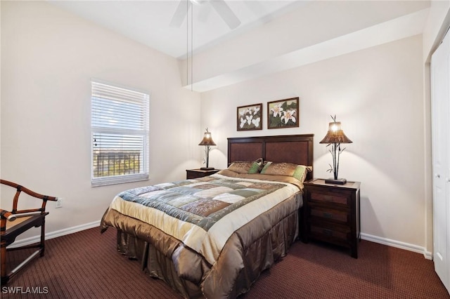 bedroom featuring ceiling fan and dark carpet