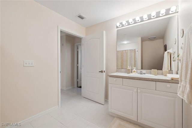 bathroom featuring vanity and tile patterned flooring