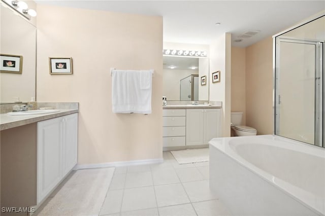 full bathroom featuring vanity, shower with separate bathtub, tile patterned floors, and toilet