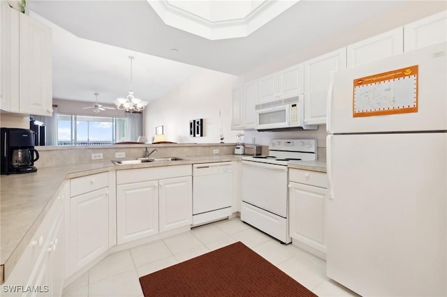 kitchen featuring white appliances and white cabinets