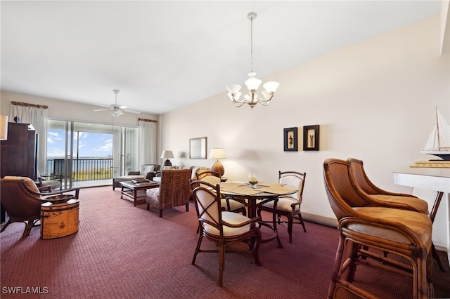 dining area featuring carpet flooring and ceiling fan with notable chandelier