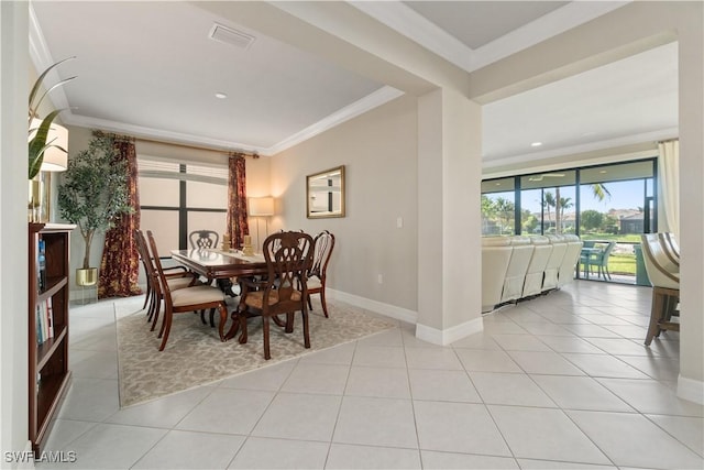 4451 Crimson Ave, Naples, FL 34119 - dining area featuring crown molding and light tile patterned flooring