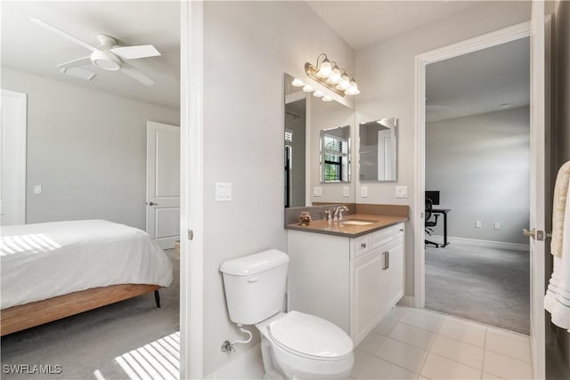 4451 Crimson Ave, Naples, FL 34119 - bathroom with tile patterned flooring, vanity, ceiling fan, and toilet