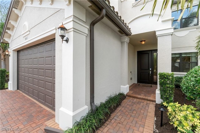 doorway to property featuring a garage