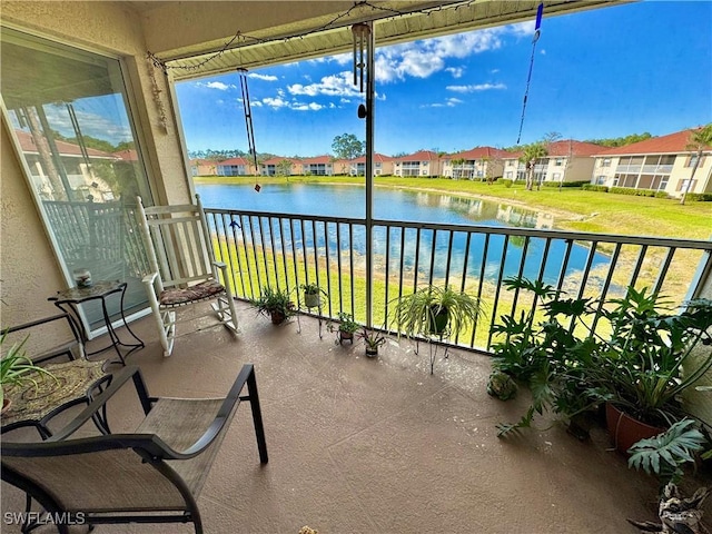 balcony featuring a water view