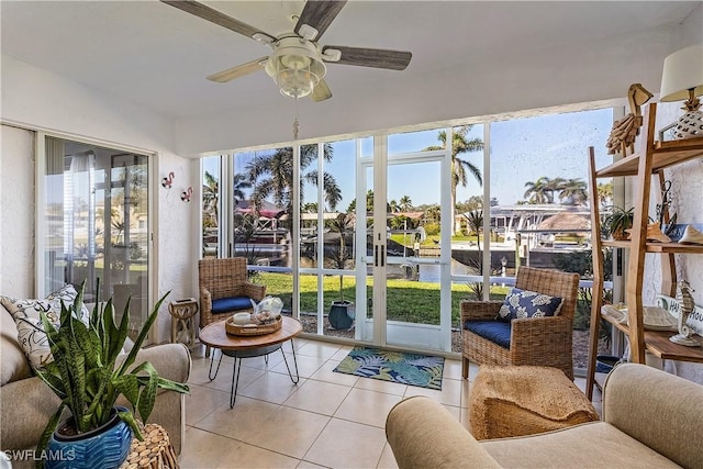 sunroom featuring ceiling fan