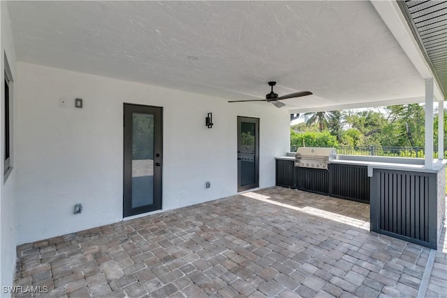 view of patio / terrace featuring grilling area, a ceiling fan, and area for grilling