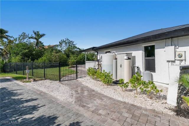 view of gate with fence