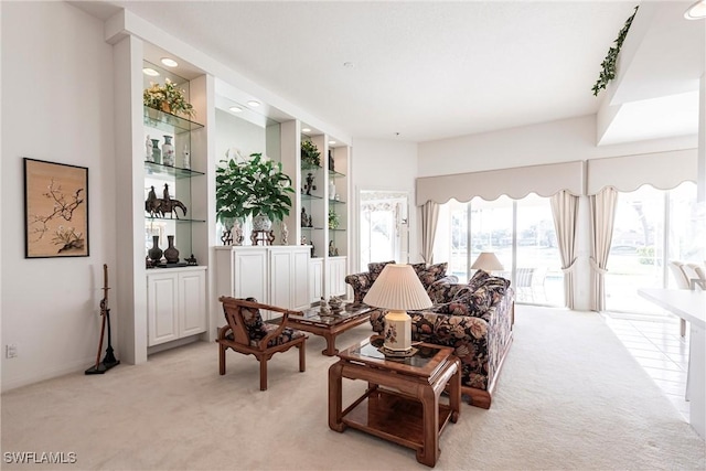 living room featuring light carpet and recessed lighting