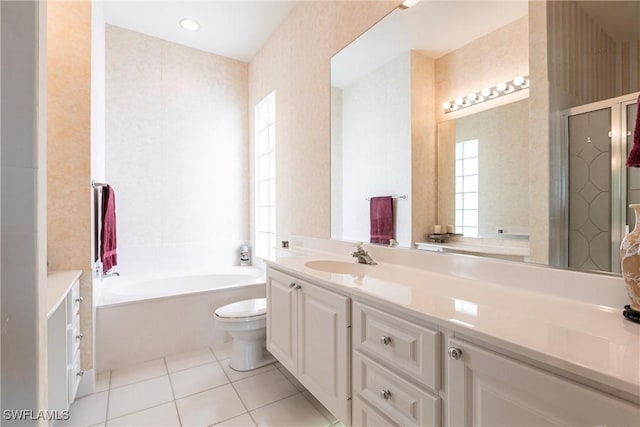 bathroom featuring a bath, tile patterned floors, toilet, a shower stall, and vanity