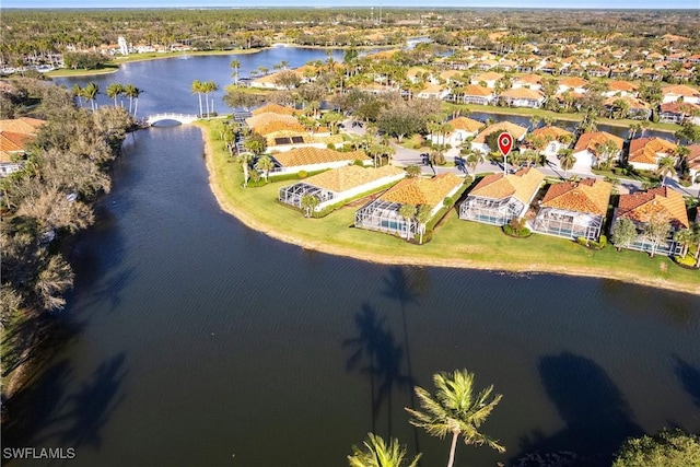 aerial view with a water view and a residential view