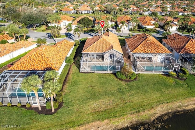 birds eye view of property with a residential view