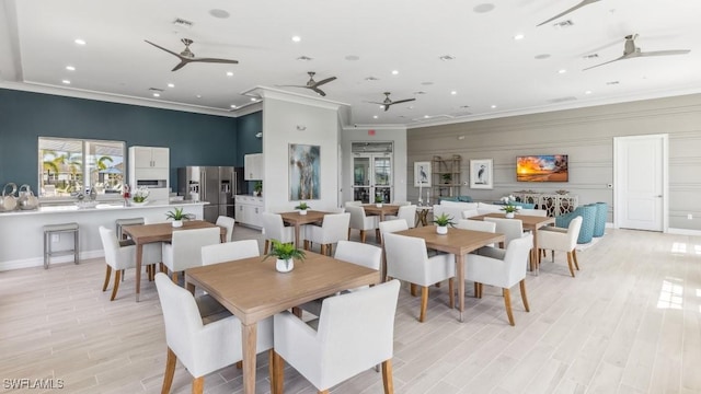 16768 Elkhorn Coral Dr, North Fort Myers, FL 33903 - dining area featuring a ceiling fan, ornamental molding, recessed lighting, light wood-style floors, and baseboards