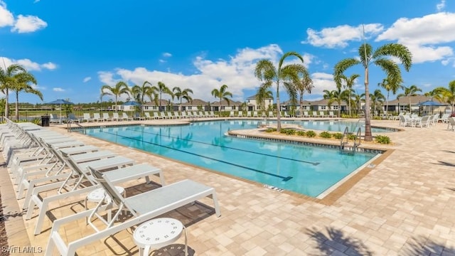 16768 Elkhorn Coral Dr, North Fort Myers, FL 33903 - community pool featuring a patio