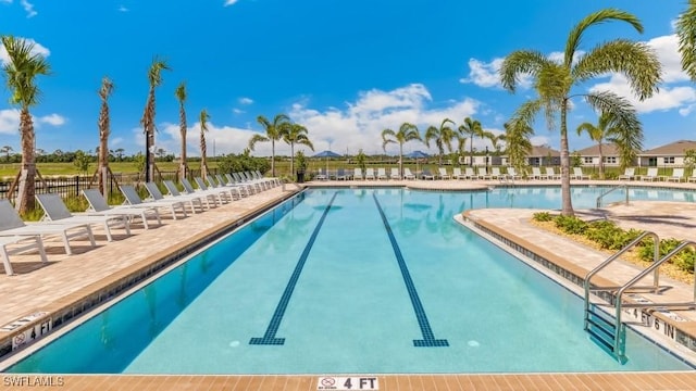 16768 Elkhorn Coral Dr, North Fort Myers, FL 33903 - community pool featuring a patio area