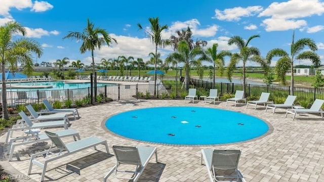 16768 Elkhorn Coral Dr, North Fort Myers, FL 33903 - community pool with a patio area and a water view