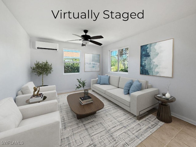 living area with a wall unit AC, ceiling fan, baseboards, and light tile patterned floors