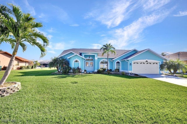 view of front of house with a garage and a front yard