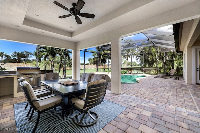 view of patio / terrace featuring a jacuzzi and exterior kitchen