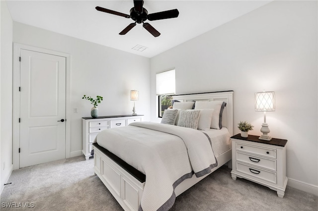 bedroom featuring light carpet and ceiling fan