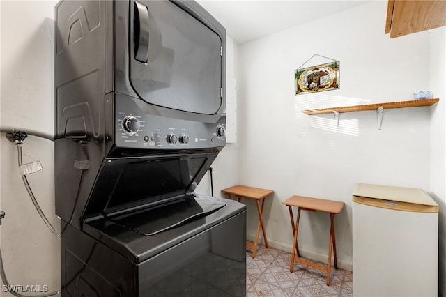 laundry room with stacked washer and clothes dryer