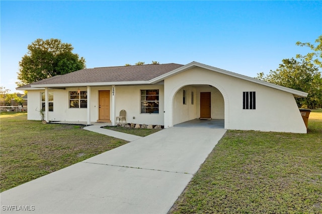 ranch-style home with a carport and a front yard