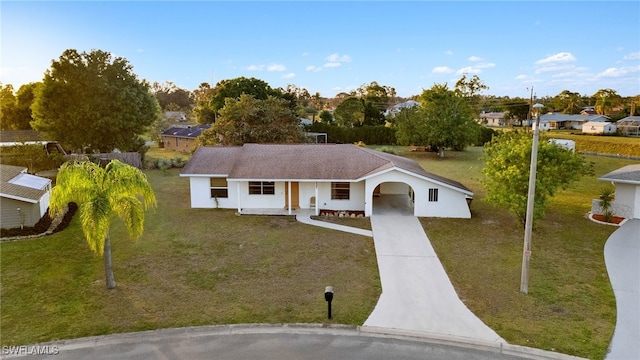 single story home featuring a porch and a front yard