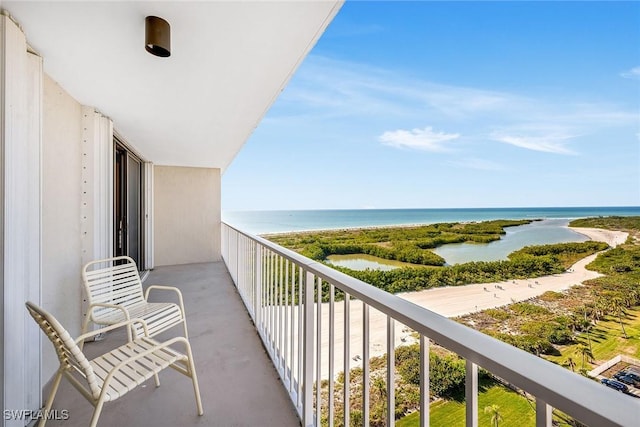 balcony featuring a water view