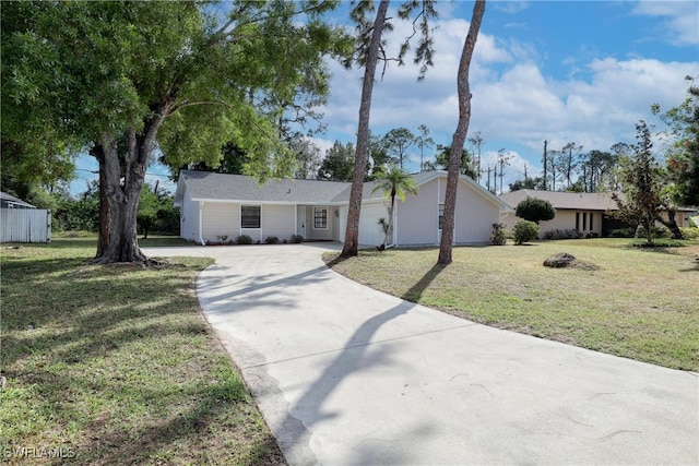 single story home with a front lawn