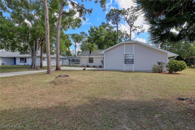 ranch-style house with a front lawn