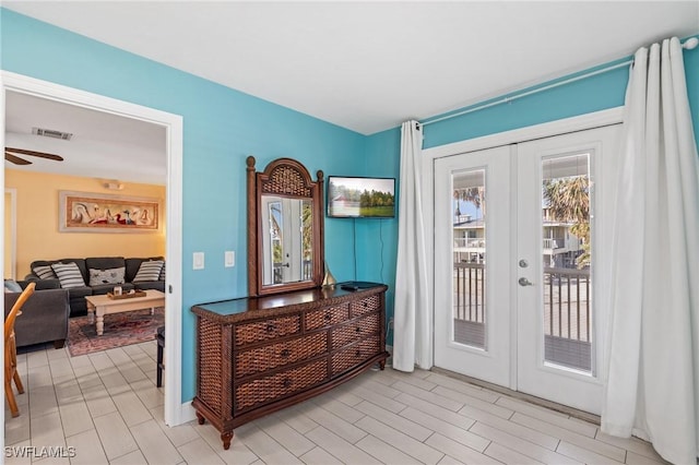 doorway with french doors and ceiling fan