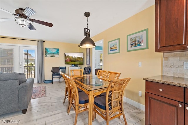 dining room featuring french doors, ceiling fan, and light hardwood / wood-style flooring