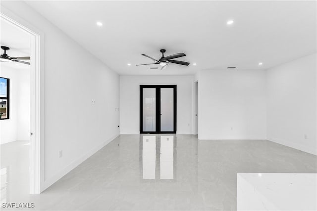 unfurnished room featuring ceiling fan, visible vents, baseboards, and recessed lighting