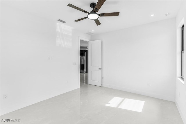 spare room with a ceiling fan, recessed lighting, and visible vents