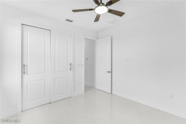 unfurnished bedroom featuring baseboards, visible vents, and a closet