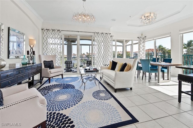 tiled living room featuring crown molding, a healthy amount of sunlight, and a chandelier