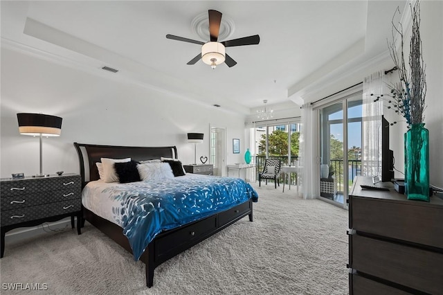 bedroom featuring carpet floors, access to outside, visible vents, and ceiling fan with notable chandelier