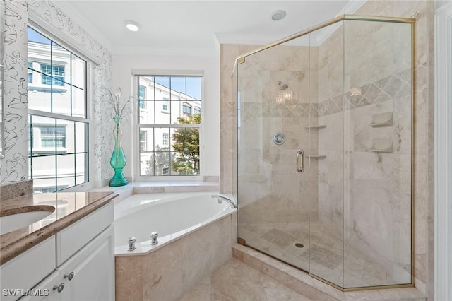 bathroom with a stall shower, crown molding, vanity, and a bath