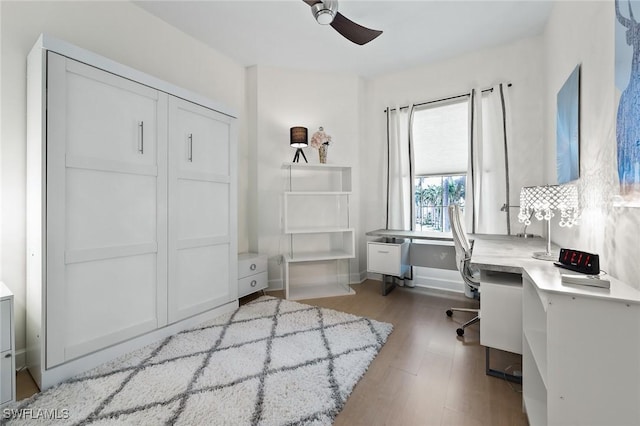 office area with ceiling fan and light wood-style floors