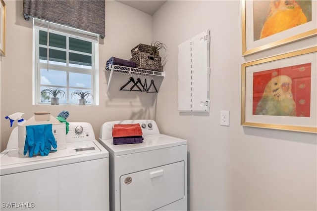 laundry room with laundry area and washing machine and clothes dryer