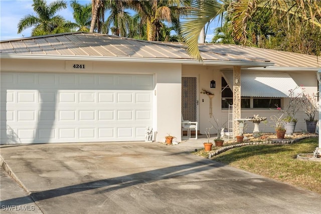 ranch-style home featuring a garage