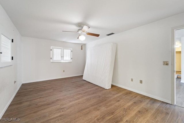 interior space featuring hardwood / wood-style floors and ceiling fan