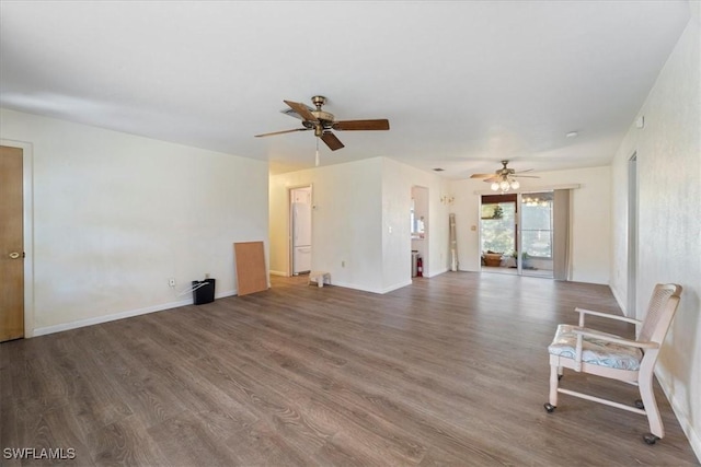 unfurnished living room featuring ceiling fan and dark hardwood / wood-style floors