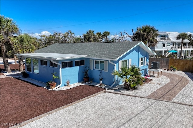 single story home featuring central AC unit