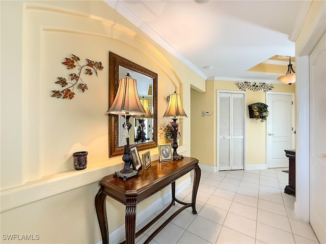 hallway with light tile patterned floors and crown molding