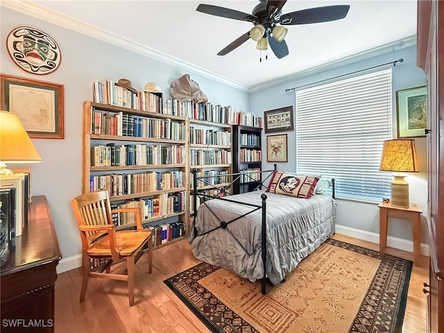 bedroom featuring ornamental molding and hardwood / wood-style floors